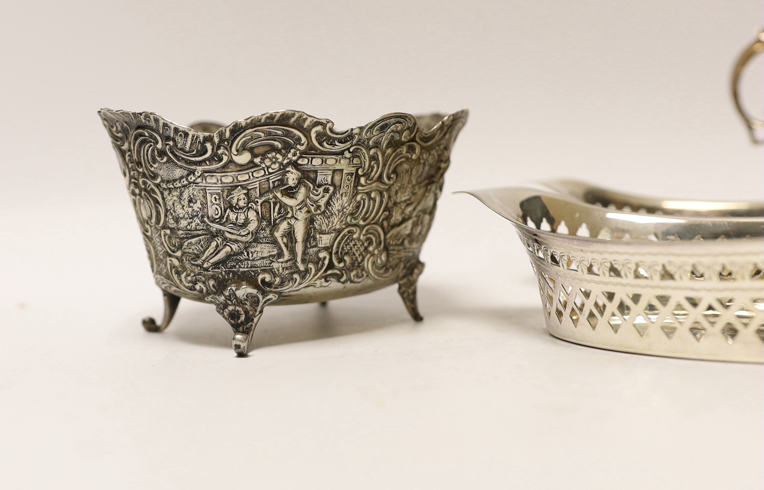 A George V silver sauce boat, three silver bonbon dishes, a small silver bowl and a Hanau white metal bowl.